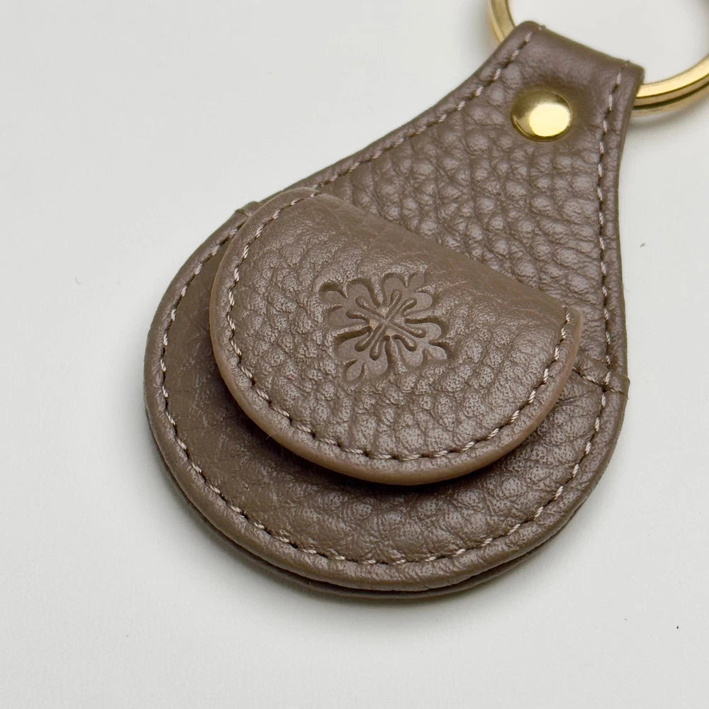PATEK PHILIPPE TAUPE LEATHER KEYCHAIN - CALATRAVA EMBLEM