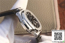 Patek Philippe Nautilus Moonphase 5712G-001 Black Dial - Watches