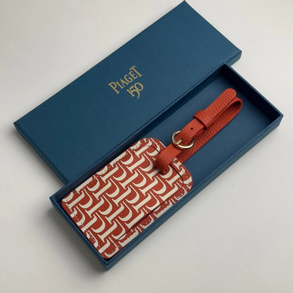 PIAGET 150TH ANNIVERSARY RED LEATHER LUGGAGE TAG