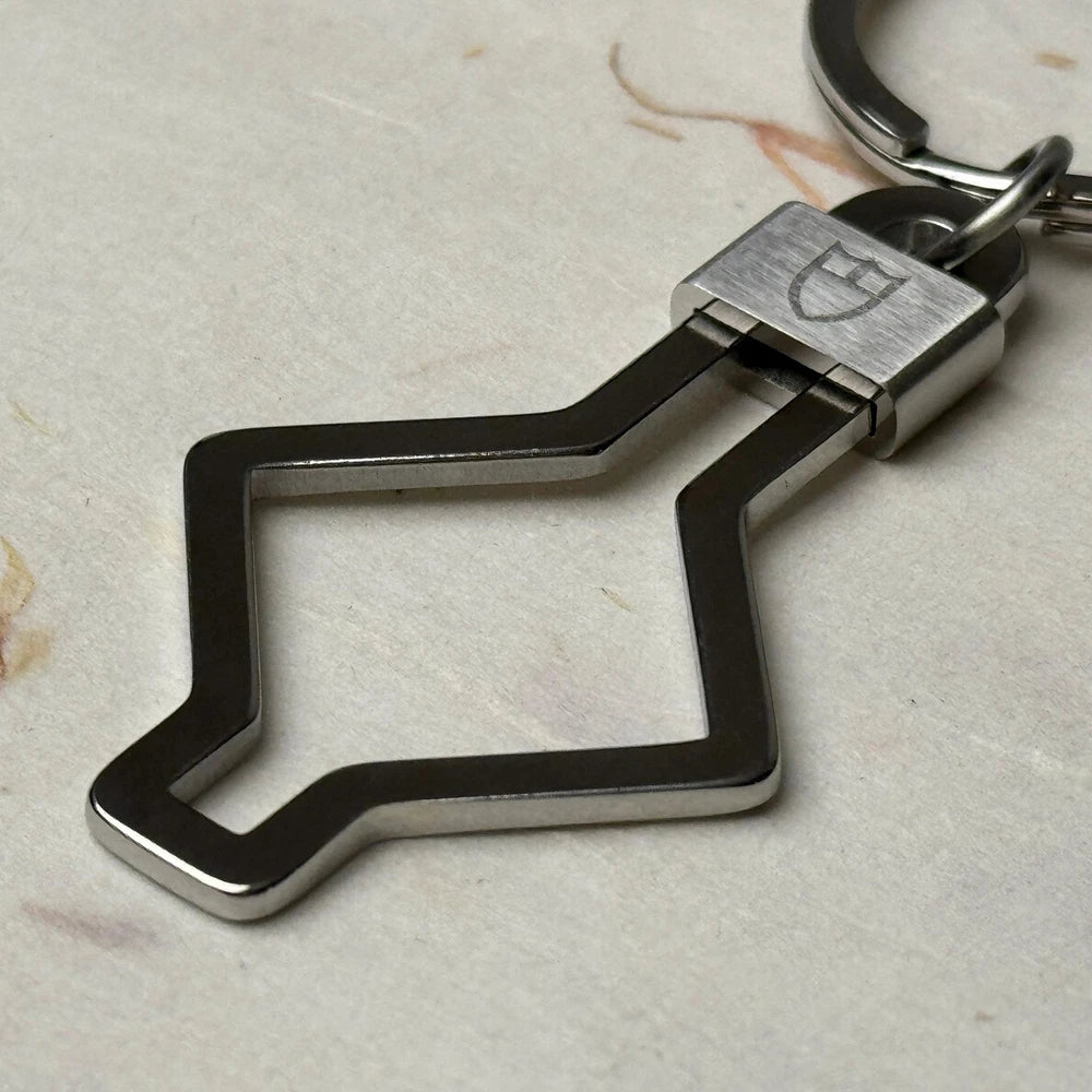 TUDOR ACCESSORIES SNOWFLAKE KEYCHAIN #001 IN STAINLESS STEEL
