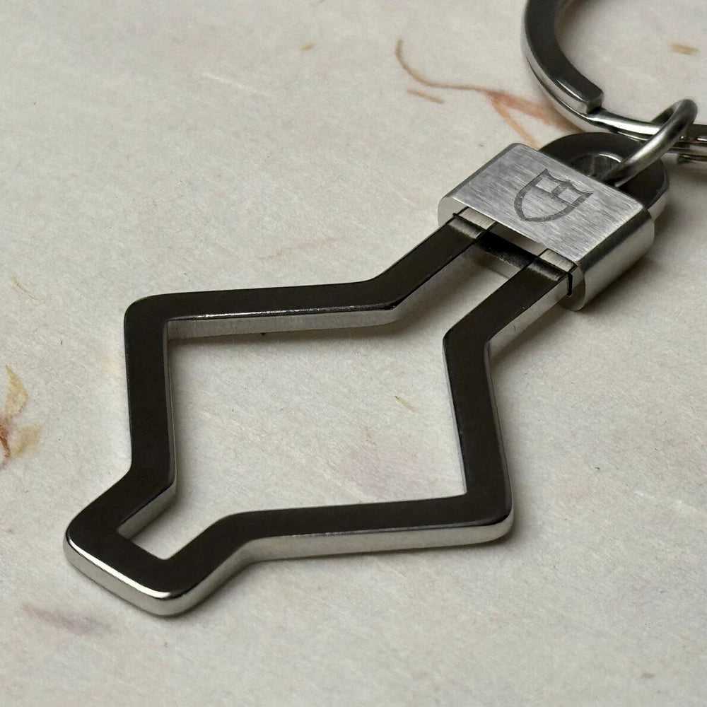 TUDOR ACCESSORIES SNOWFLAKE KEYCHAIN #001 IN STAINLESS STEEL