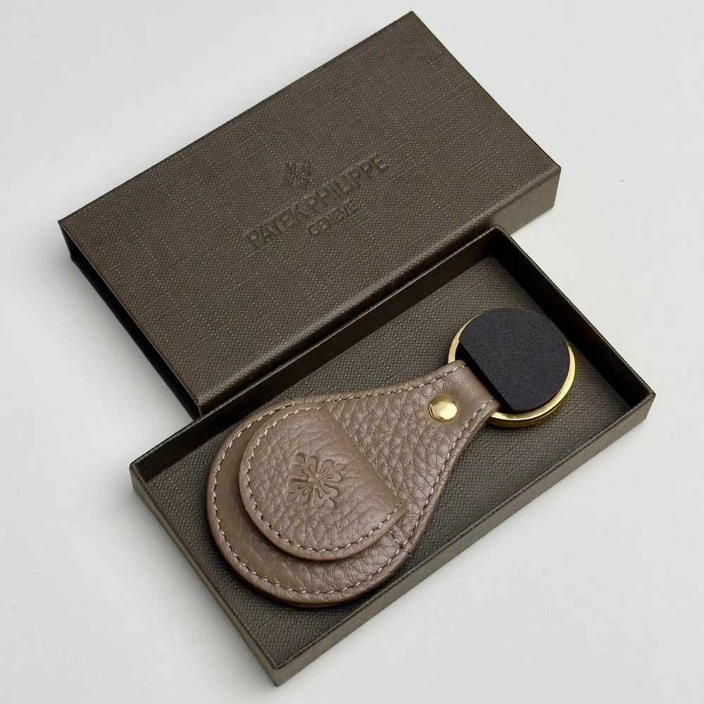 PATEK PHILIPPE TAUPE LEATHER KEYCHAIN - CALATRAVA EMBLEM